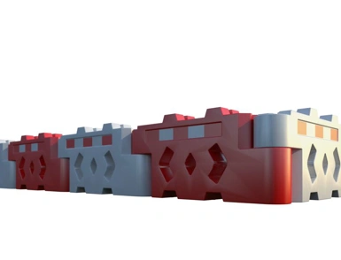 Row of interlocking red and white water-filled traffic barriers
