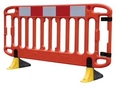 Single orange plastic pedestrian safety barrier with reflective panels and yellow feet