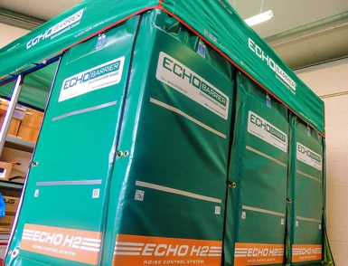 Echo Barrier H2 noise control enclosure with green acoustic panels